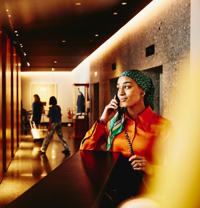 Hotel receptionist answering the phone.